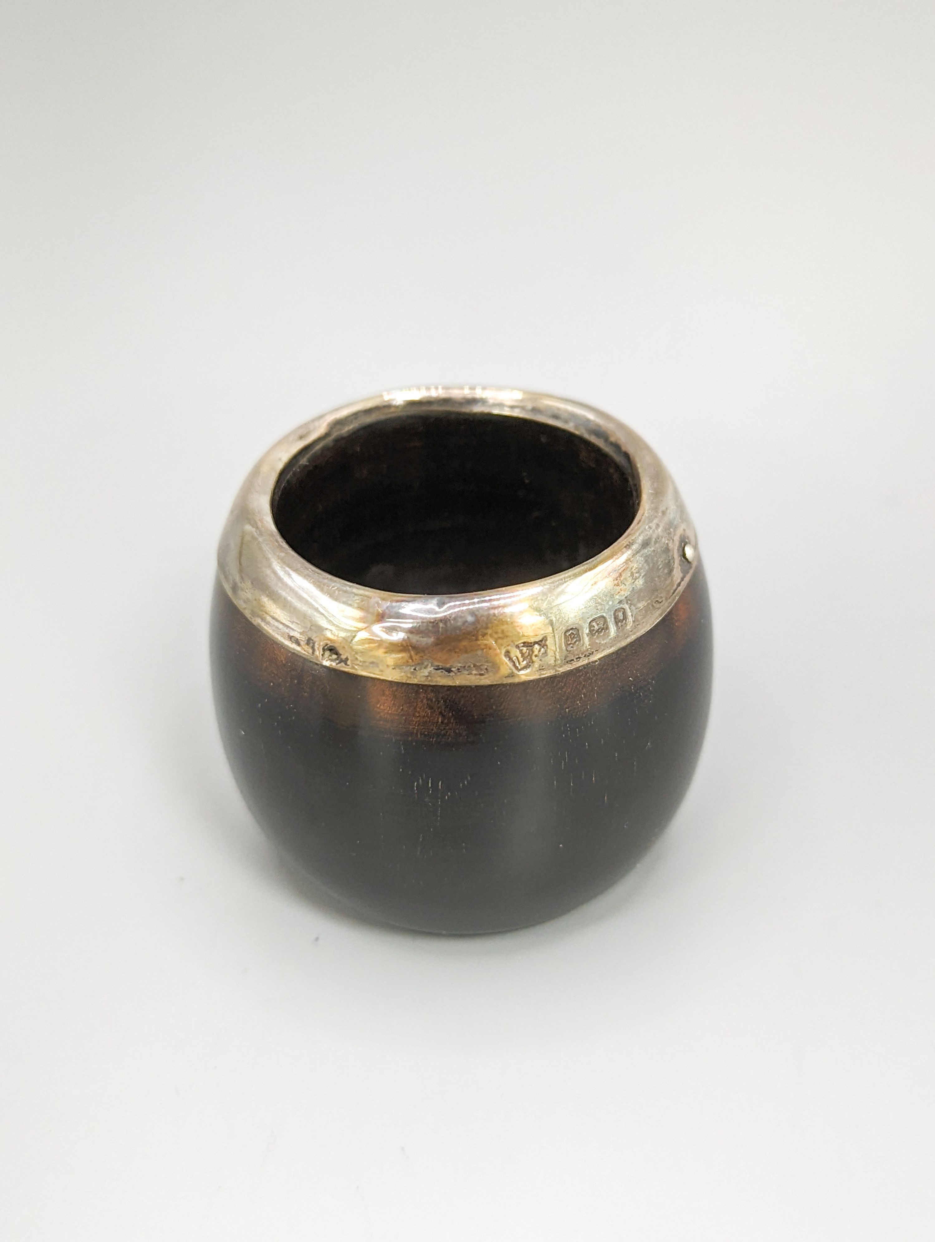 An early 19th century ivory circular box with central cartouche, a tortoiseshell match holder, diameter 9cm, and a pierced pot
